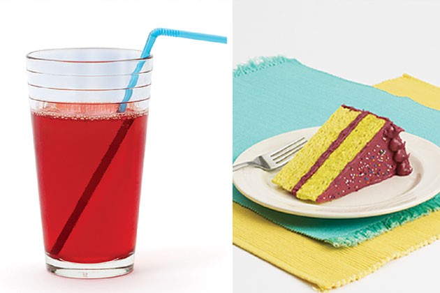 A glass of juice and a slice of cake on a plate