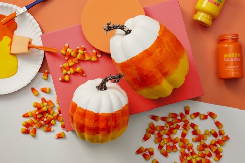 Uncarved pumpkins painted in candy corn colors.