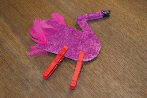 Flamingo made from paper, clothespins and glitter.